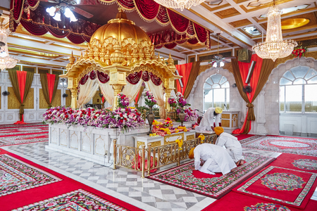 BANGKOK, THAILAND - DECEMBER 13, 2014: Gudwara Sri Guru Sing Saba is the beautiful Sikh temple in Bangkok, Thailand, The altar with golden color and red velvet decoration, the place of worship.のeditorial素材
