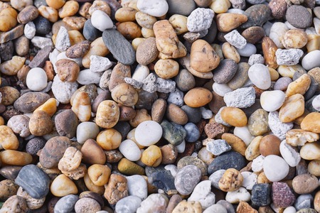 Mixed of multi-color of pebble stones in different size background. Closeup, Top view.の写真素材