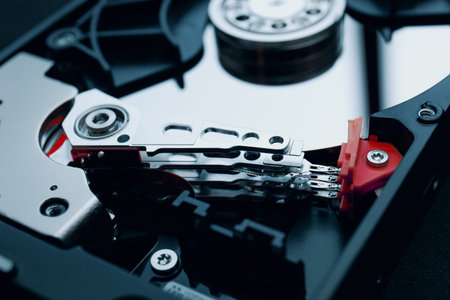 Disassembled magnetic device hard disk, hard drive, data storage, HDD, Read and write head with the...