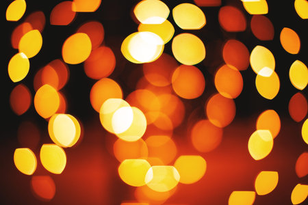 A group of circle and oval shape from red and yellow lights defocused abstract background, Lens...