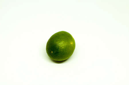 One Fresh Green Lime Isolated in White Backgroundの写真素材