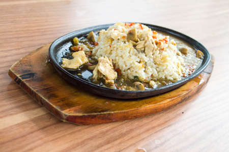 Chicken Rice Served in Hot Plate Front Viewの写真素材