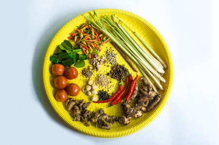 All Herb and Spices in Yellow Winnowing Tray or Tampah  White Backgroundの写真素材