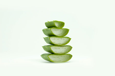 High Stacks of Aloe Vera Front Left Perspective View Fresh Closeup in White Backgroundの写真素材