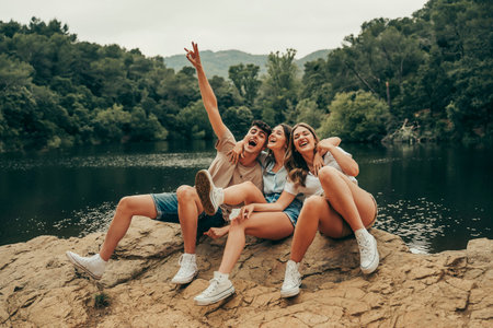 Group of young friends hiking on a lake vacation.の写真素材
