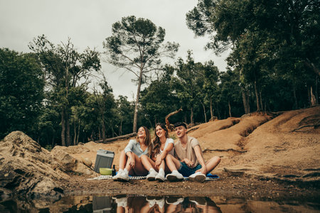 Friends hugging in a natural lake in the middle of the forest.