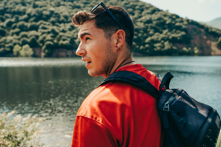 Young hiker hiking on a lake in nature.