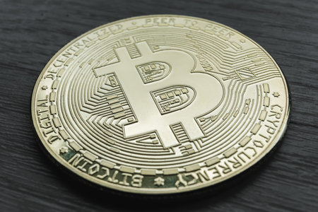 Close-up photo of the Bitcoin crypto currency with the background out of focus