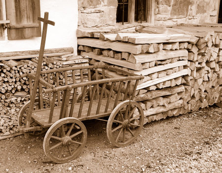 Old wooden hand cart for firewood.の写真素材