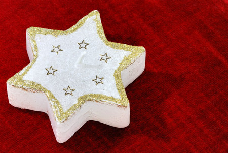 Christmas candle in form of a starの写真素材
