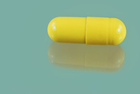 Macro of a yellow vitamine capsule