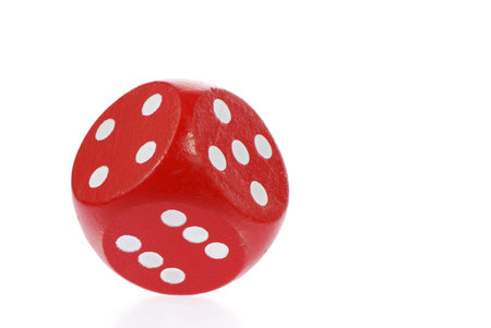 Macro of a rolling red dice