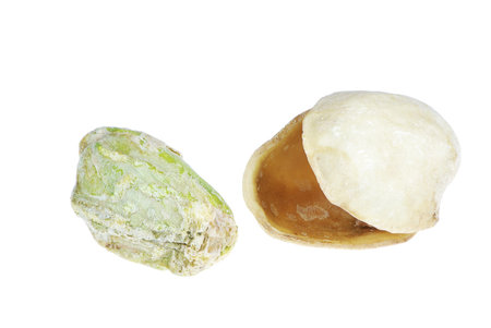 Single roasted and salted pistachio nut and its shell