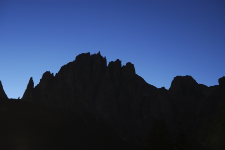 Mountain silhouette in the dolomites (Italy)の写真素材