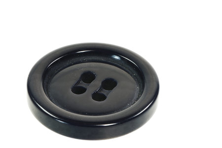 Macro of an isolated black button