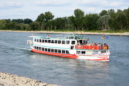 SPEYER, GERMANY - SEPTEMBER 1: Tourists making a ship round trip on the river Rhein in Speyer, Germany on September 1, 2013. Speyer is one of the oldest towns of Germany. Foto taken on Leinpfad with view accross the Rhein.のeditorial素材