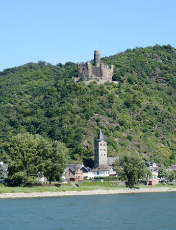 WELLMICH, GERMANY - SEPTEMBER 2: Maus Castle above Wellmich, Germany on September 2, 2013. The castle was built in the 14th century - it has never been destroyed. Foto taken from a passenger ship on the Rhine.のeditorial素材