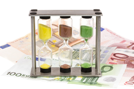 Sandglass and a couple of eure banknotes の写真素材