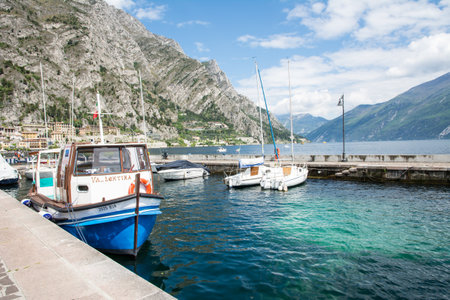 LIMONE, ITALY - APRIL 22: Marina in the village of Limone, Italy on April 22, 2014. The town at Lake Garda is famous for the cultivation of lemons. Foto taken from the water front in Limone.のeditorial素材