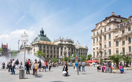 MUNICH, GERMANY - JUNE 4: Tourists in the pedestrian area of Munich, Germany on June 4, 2014. Munich is the biggest city of Bavaria  with almost 100 million visitors a year. Foto taken from Karlsplatz with view to Justizpalast.のeditorial素材
