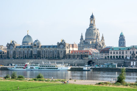 DRESDEN, GERMANY - SEPTEMBER 4: Tourists at the promenade of the river Elbe in Dresden, Germany on September 4, 2014. Dresden has almost 2 million visitors a year. Foto taken from Augustus bridge.のeditorial素材