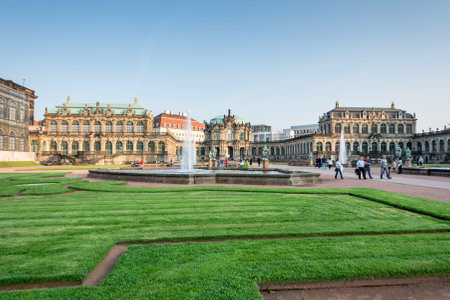 DRESDEN, GERMANY - SEPTEMBER 4: Tourists at the Zwinger palace in Dresden, Germany on September 4, 2014. By 1963 the Zwinger had largely been restored after it was completely destroyed 1945. Foto taken from the public Zwinger park.のeditorial素材