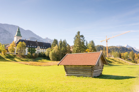 KLAIS, GERMANY - SEPTEMBER 28: Schloss Elmau in Klais, Germany on September 28, 2014. The castle which is now a luxury hotel will be the site of the  G7 summit in 2015. Foto taken from Elmauer Weg with view to the castle.のeditorial素材