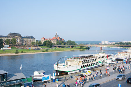 DRESDEN, GERMANY - SEPTEMBER 4: Tourists at the promenade of the river Elbe in Dresden, Germany on September 4, 2014. Dresden has almost 2 million visitors a year. Foto taken from Terassenufer.のeditorial素材