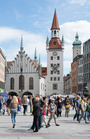 MUNICH, GERMANY - AUGUST 25: Tourists at the Marienplatz in Munich, Germany on August 25, 2014. Munich is the biggest city of Bavaria with almost 100 million visitors a year. Foto taken from Marienplatz.のeditorial素材