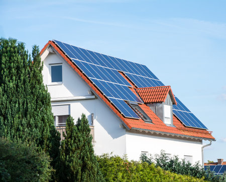 Modern house with photovoltaic solar cells on the roof for alternative energy productionのeditorial素材