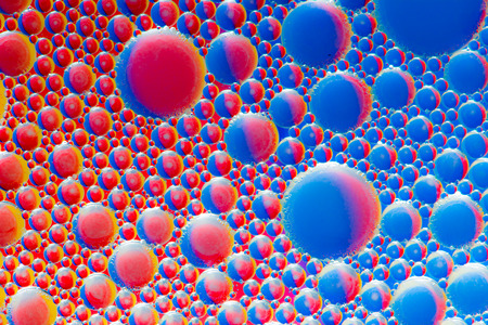 Colorful abstract macro background with oil drops in waterの写真素材