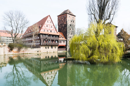 The Wasserturm (water tower, built 13th century)  and the Weinstadl (Former Wine Depot, built 15th century) - medieval buildings in historic Nurembergのeditorial素材