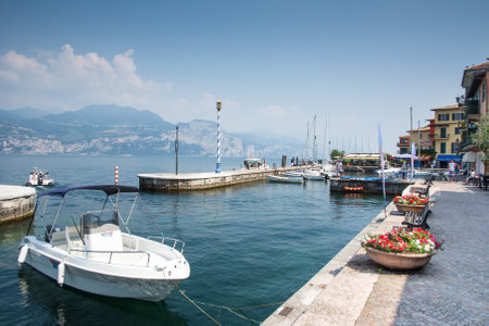 CASTELLETTO, ITALY - JUNE 2: Marina at Lake Garda in Castelletto, Italy on June 2, 2015. Lake Garda is one of the most frequented tourist regions of Italy. Foto taken from Castelletto water front with view to the marina.のeditorial素材