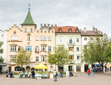 BRIXEN, ITALY - SEPTEMBER 22: Tourists at the Piazza Duomo in Brixen, Italy on September 22, 2015. Brixen is one of the oldest towns of Tyrol. Foto taken from Piazza Duomo with view to the town hall.のeditorial素材