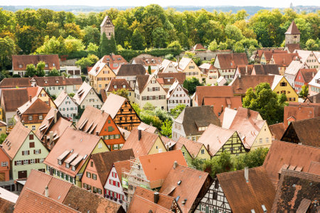 DINKELSBUEHL, GERMANY - SEPTEMBER 27: View over the city of Dinkelsbueh, Germany on September 27, 2015. It is one of the best preserved medieaval towns in Germany. Foto taken from the tower of the MInster St. Georg with view over the town.のeditorial素材
