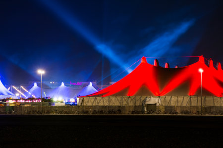 MUNICH, GERMANY - DECEMBER 12: Illuminated tents at the Tollwood winter festival in Munich, Germany on December 12, 2015.  Foto taken from Theresienwiese with view to the festival tents.のeditorial素材