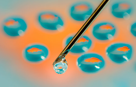 Fish reflections in a drops from a syringe - could be used to illustrate genetic engeneering,...