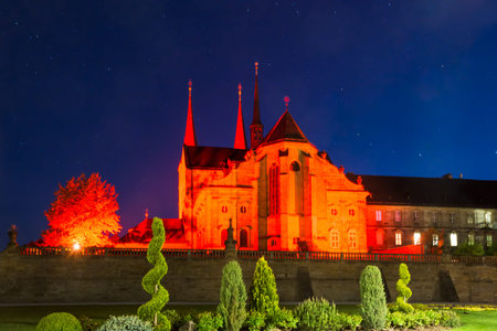 Illuminated Michelsberg Abbey (Kloster Michelsberg) in Bamberg at nightの写真素材