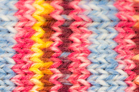 Closeup of a knitted woolen multicolored backgroundの写真素材