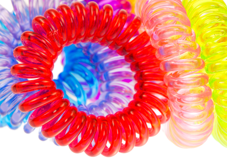 Closeup of various isolated spiral hair tiesの写真素材