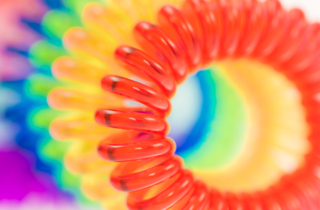 Abstract background of various spiral hair ties with selective focus and shallow depth of field.の写真素材