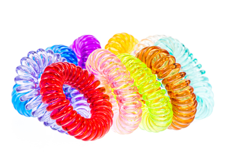 Closeup of various isolated spiral hair tiesの写真素材