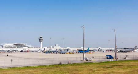 MUNICH, GERMANY - APRIL 9: Planes in parking position at the the airport of Munich, Germany on April 9, 2017. The ariport has over 40 million passengers a year. Foto taken from the visitor platform of the airport.のeditorial素材