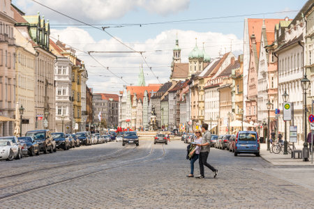 AUGSBURG, GERMANY - MAY 20: People and cars on a street in Augsburg, Germany on May 20, 2017. Augsburg is one of the oldest cities of Germany. Foto taken from Maximilianstrasseのeditorial素材