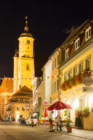 VOLKACH, GERMANY - August 20: Tourists at the historic old town of Volkach, Germany on August 20, 2017. Volkach is famous for its annual wine festival.のeditorial素材