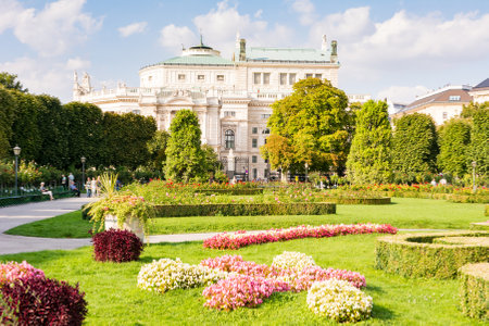 VIENNA, AUSTRIA - AUGUST 28: People in the public Voksgarte park of Vienn Vienna, Austria on August 28, 2017. View to Burgtheater.のeditorial素材