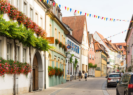 VOLKACH, GERMANY - August 20: Tourists at the historic old town of Volkach, Germany on August 20, 2017. Volkach is famous for its annual wine festival.のeditorial素材