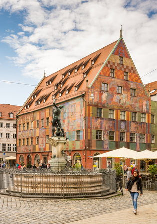 AUGSBURG, GERMANY - AUGUST 19: Old town with Merkur fountain and Weberhaus house in Augsburg, Germany on August 19, 2017. Augsburg is one of the oldest cities of Germany.のeditorial素材