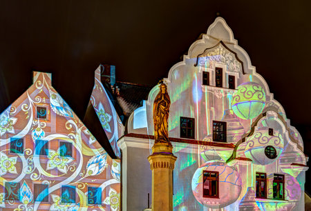PFAFFENHOFEN, GERMANY - DEZEMBER 17: Illuminated house facades in Pfaffenhofen, Germany on Dezember 17, 2017. In the Advent all houses of the old town are lighted with christmassy pirctures.のeditorial素材