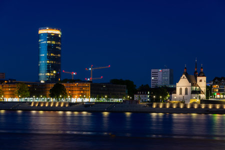 COLOGNE, GERMANY - MAY 12: Riverbank of the river Rhine at night in Cologne, Germany on May 12, 2019. View to Triangle tower.のeditorial素材